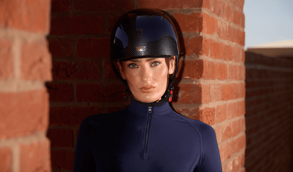 Rider wearing a Premier Equine Artemis jockey skull cap